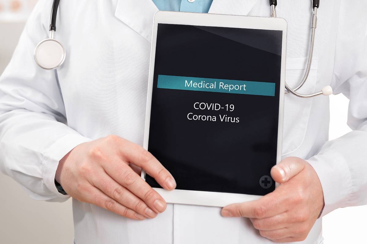 Doctor holding medical report of COVID-19